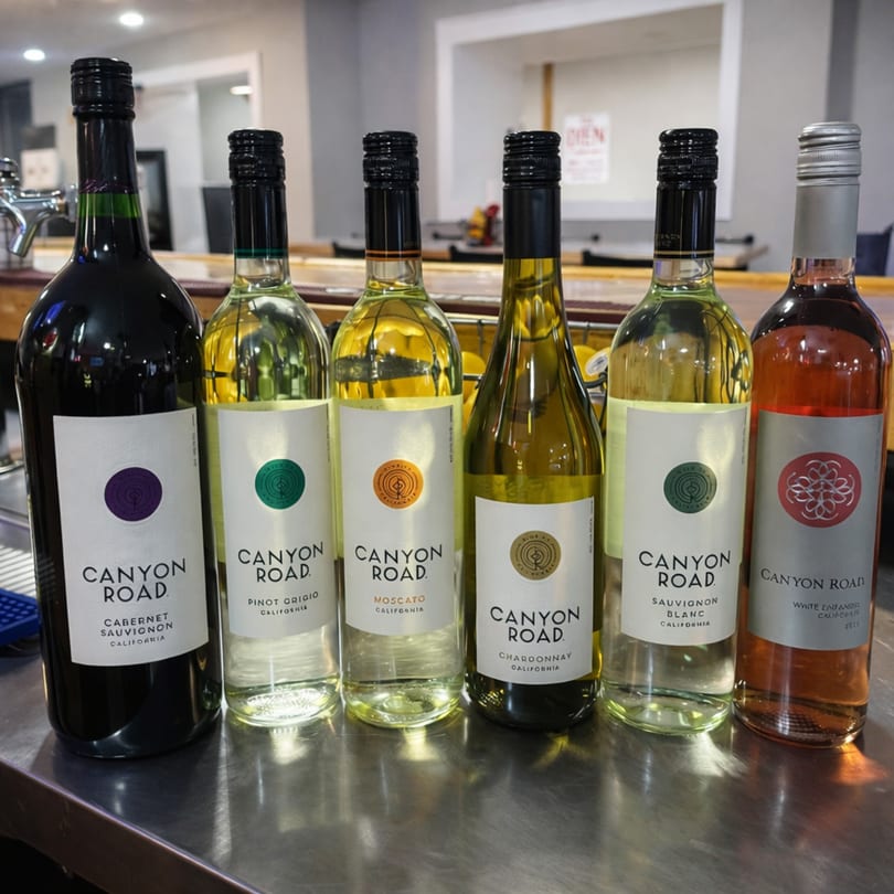 Six bottles of Canyon Road wine, including Cabernet Sauvignon, Pinot Grigio, Moscato, Chardonnay, Sauvignon Blanc, and White Zinfandel.